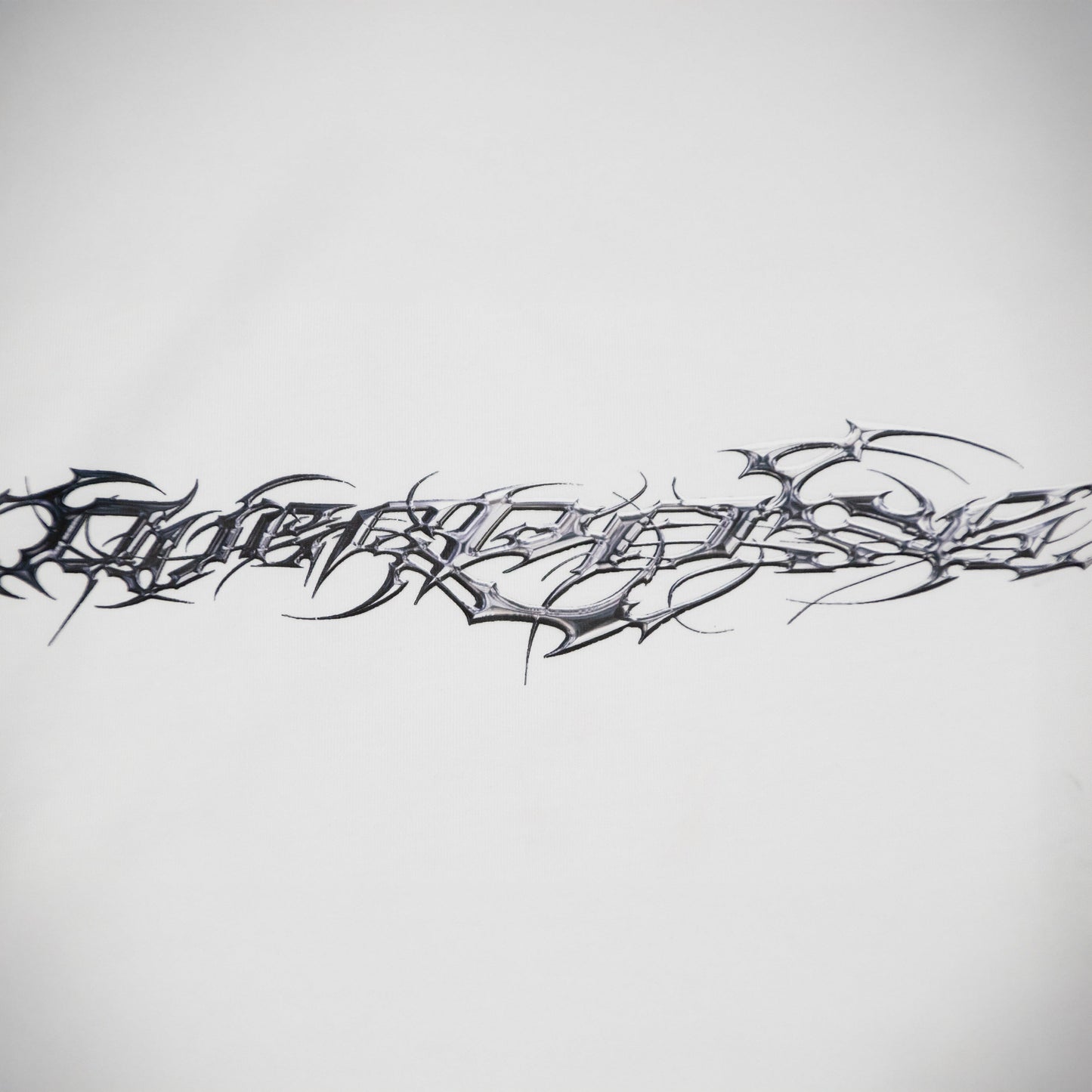 "TRIBAMETAL" LOGO TRNSFRMR L/S - ANGEL